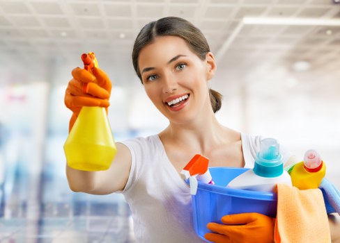 Cleaner reviewing safety checks before starting an end of tenancy job