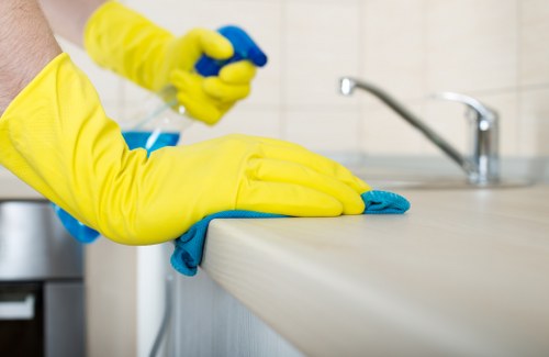 End of tenancy cleaner working safely in a cleaned property